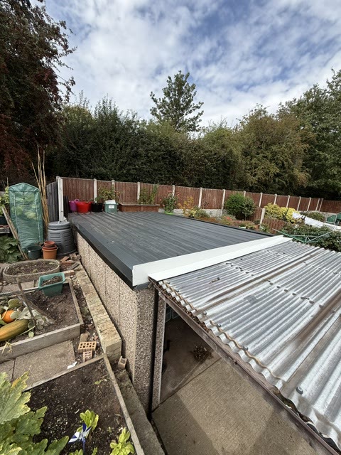 The same garage re-roofed in anthracite box-profile steel