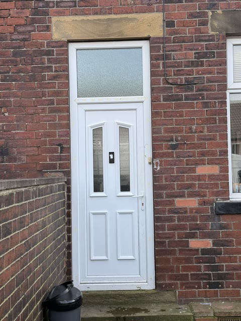 White uPVC back door with a glazed panel above the head