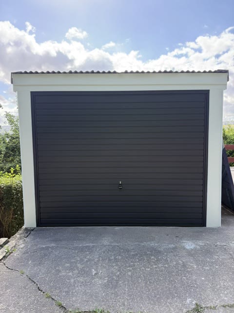 New anthracite up-and-over door with white cladding to the posts and head